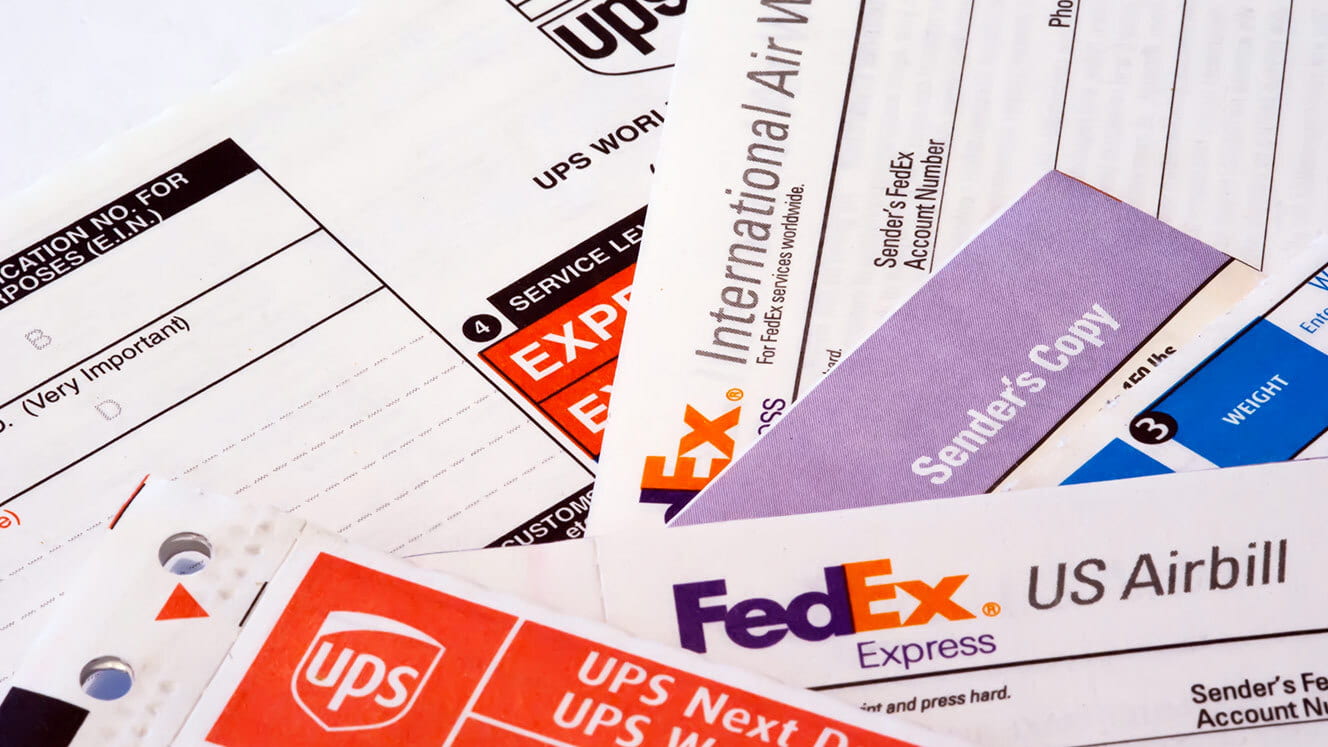 Pile of FedEx and UPS paperwork