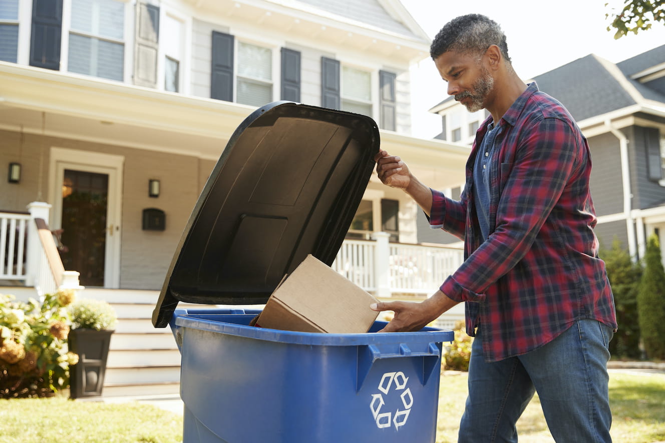 Man throwing away trash