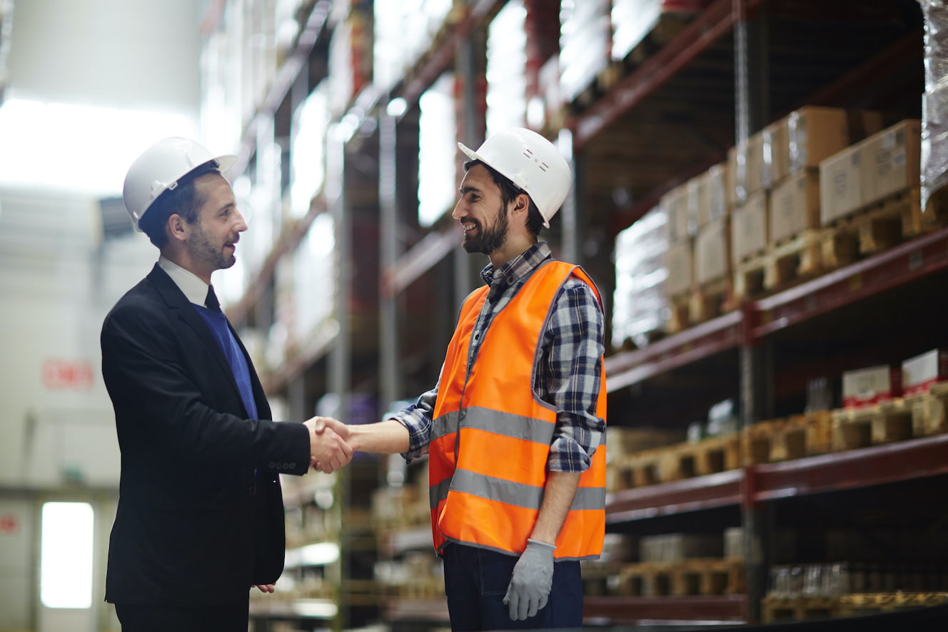 People in Hardhats Shaking Hands