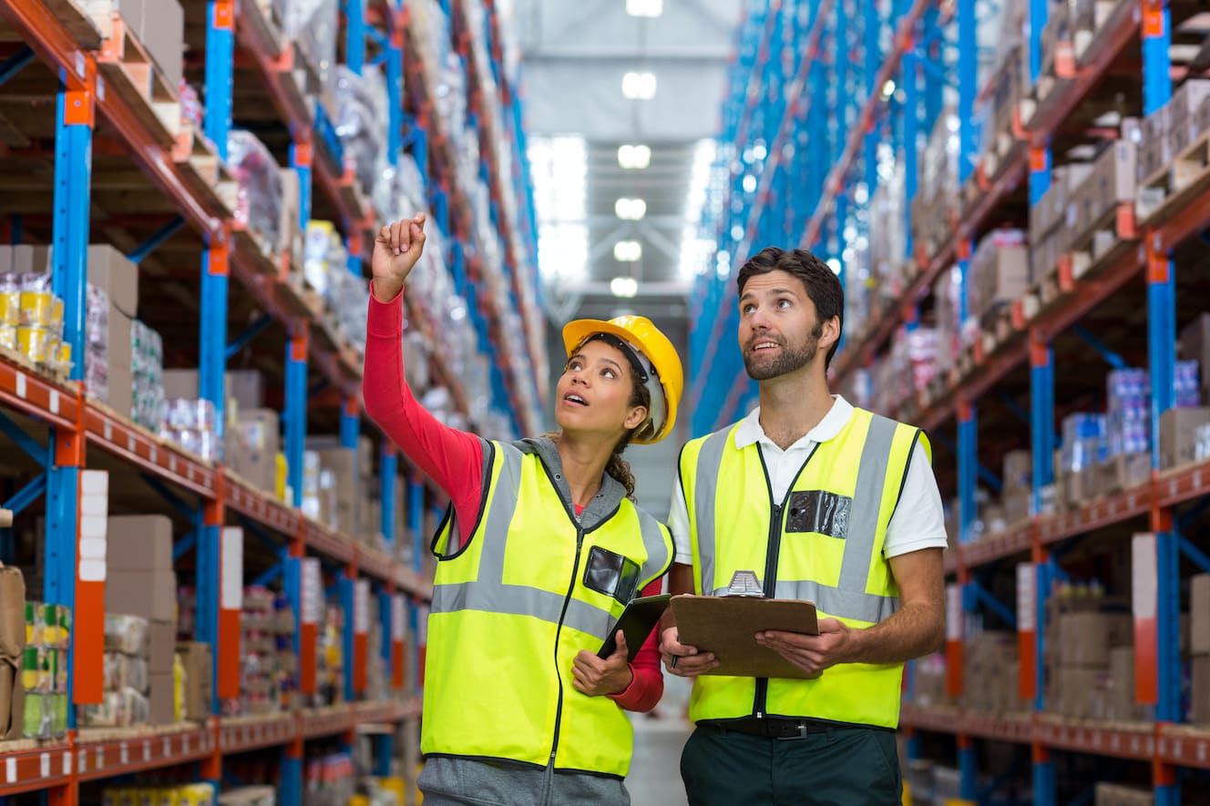 Person in warehouse pointing for another to look
