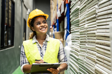 Person in Warehouse with Checklist
