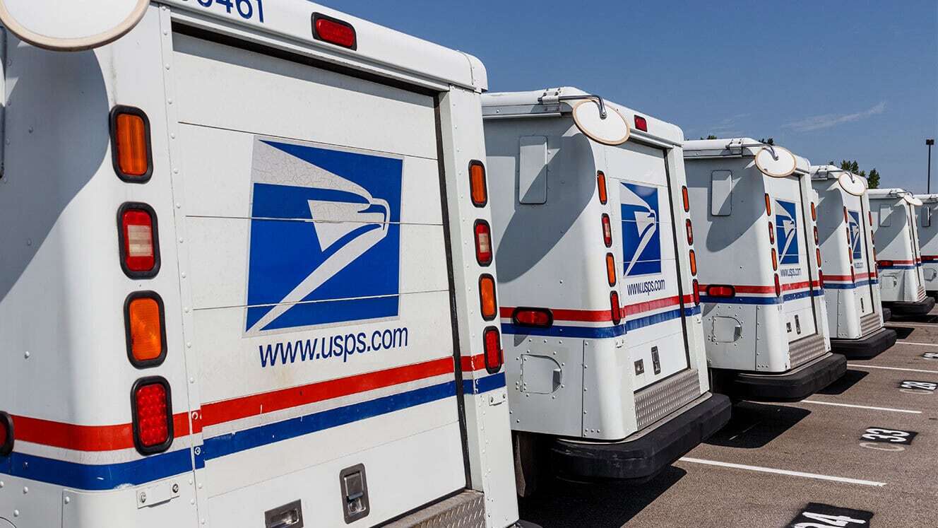 usps trucks parked in a row