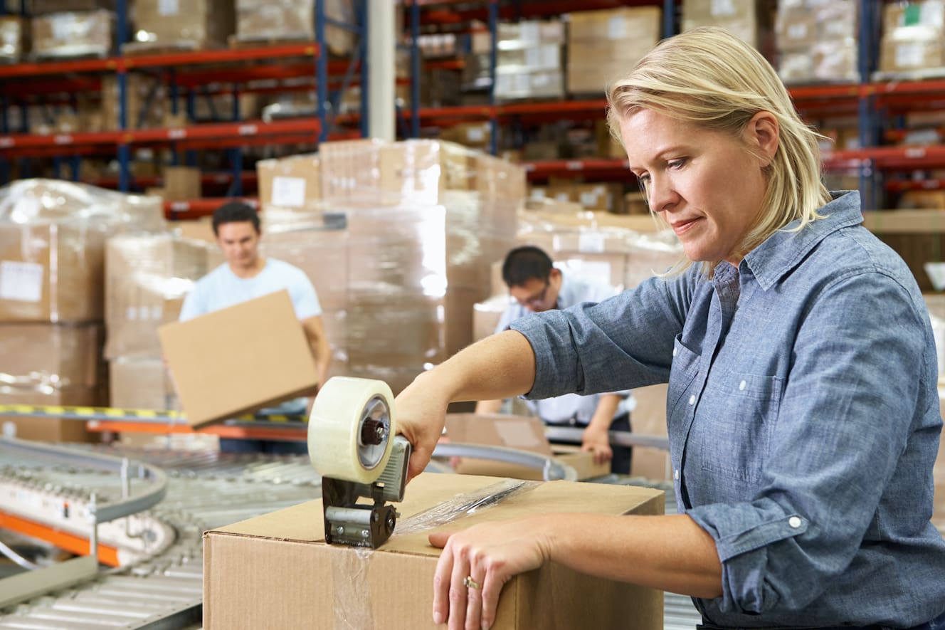 Woman packing in warehouse